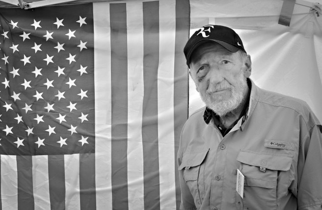 Man by the flag of the USA